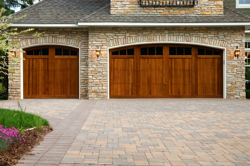 Natural Stone Facade With Arched Garage Doors